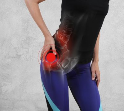 Woman with hip joint pain. Sport exercising injury